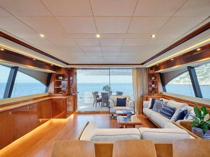 a living room with a large window aboard ESTIA YI Yacht for Sale