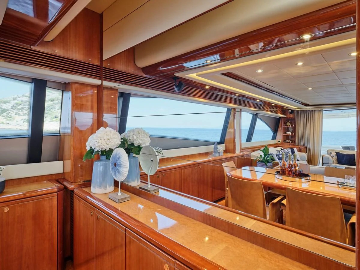 a room with a table and chairs aboard ESTIA YI Yacht for Sale