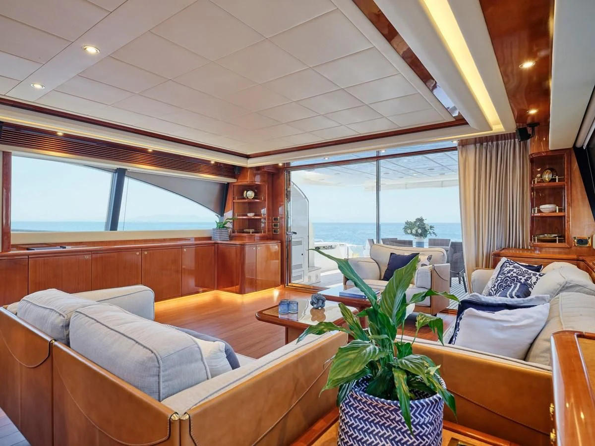 a living room with a couch and a table aboard ESTIA YI Yacht for Sale