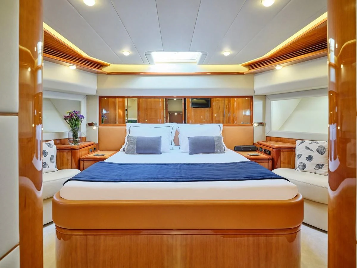 a room with a bed and a desk aboard ESTIA YI Yacht for Sale