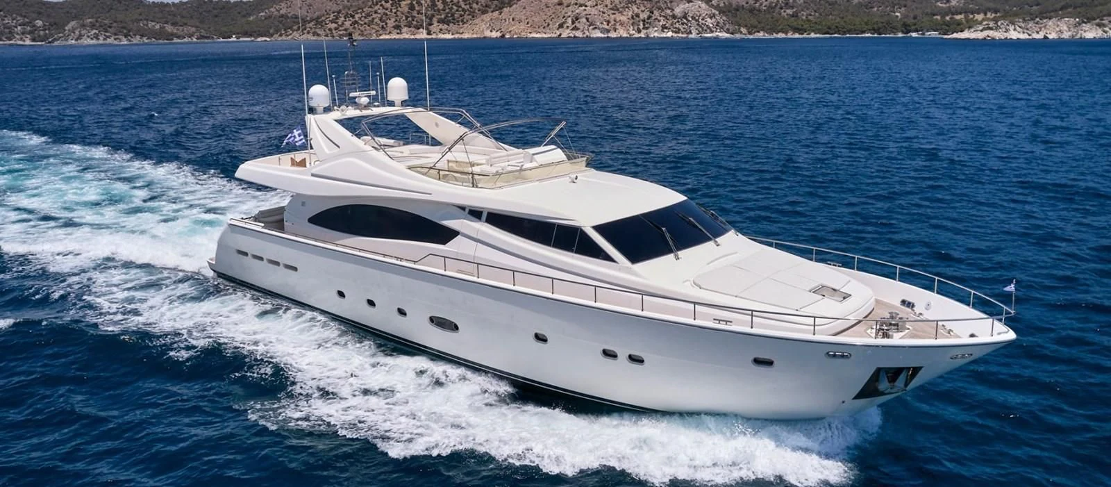 a white yacht on the water aboard ESTIA YI Yacht for Sale