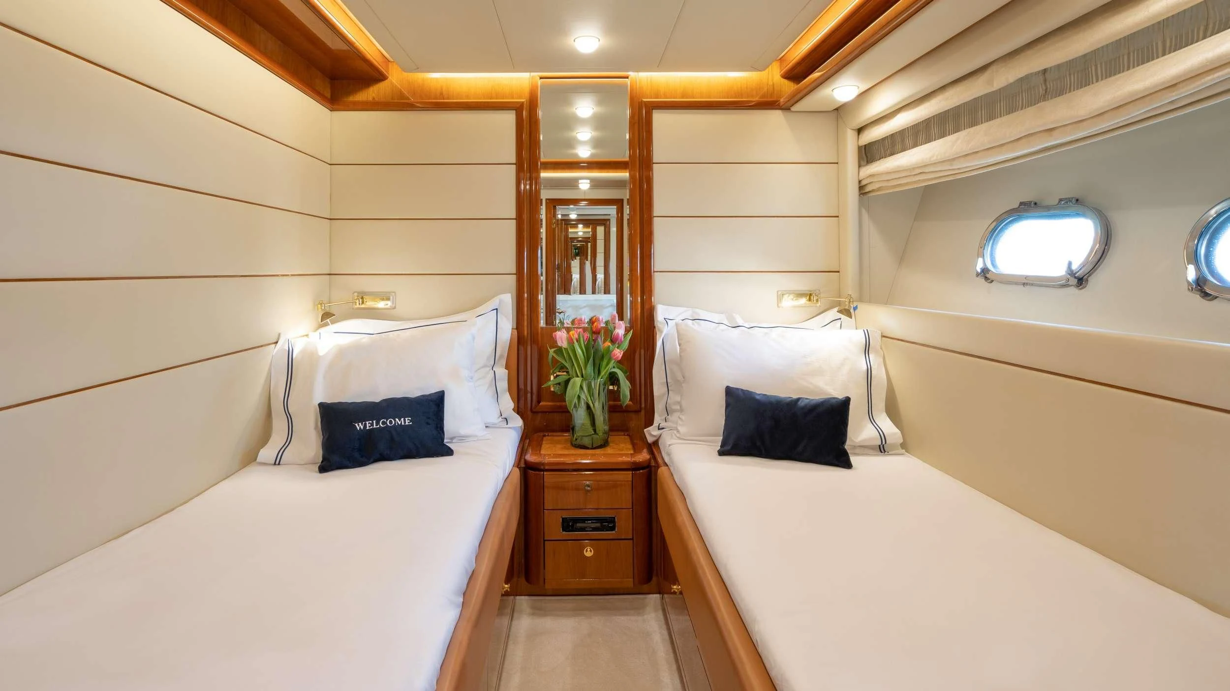 a room with a bed and a mirror aboard ESTIA YI Yacht for Sale