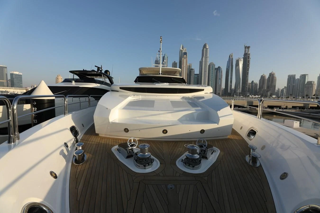 a white yacht on a deck aboard SUNSEEKER 30M Yacht for Sale