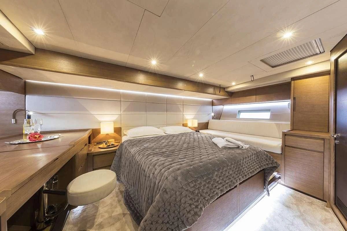 a large bedroom with a bed aboard JIKAN Yacht for Charter