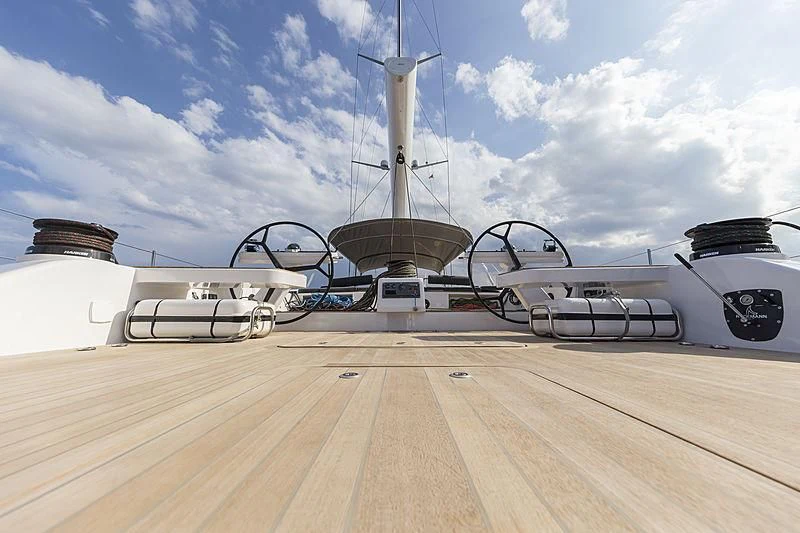 a large metal object on a wooden surface aboard JIKAN Yacht for Charter
