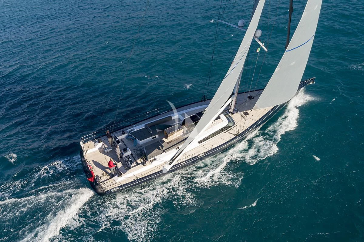 a helicopter flying over a boat aboard JIKAN Yacht for Charter