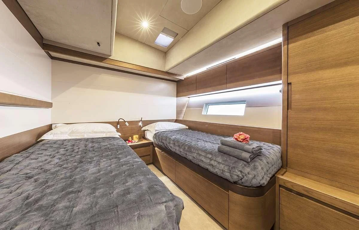 a room with two beds aboard JIKAN Yacht for Charter