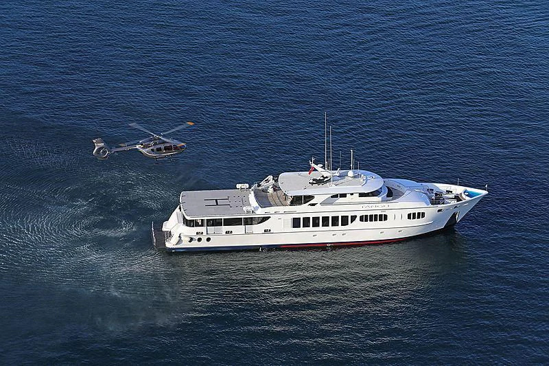 a boat and helicopter in the ocean aboard TANGO Yacht for Sale