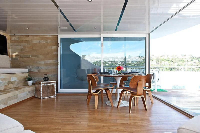 a room with a table and chairs aboard TANGO Yacht for Sale