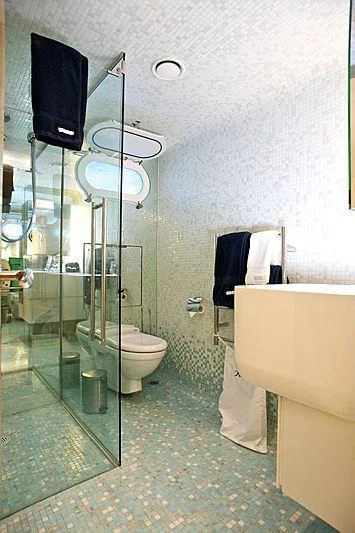 a bathroom with a glass shower aboard TANGO Yacht for Sale