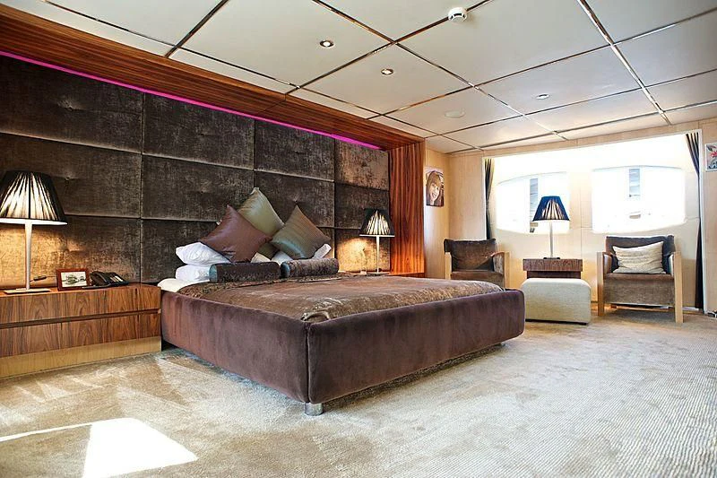 a large bed in a room aboard TANGO Yacht for Sale
