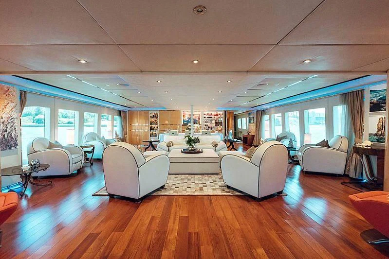 a living room with a wood floor aboard TANGO Yacht for Sale