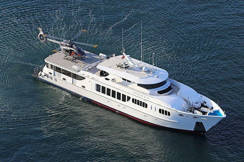 a helicopter flying over a boat aboard TANGO Yacht for Sale