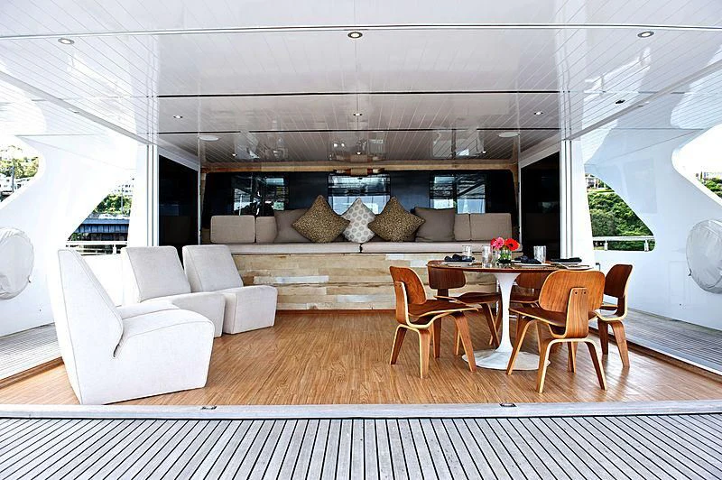 a living room with a couch and a table aboard TANGO Yacht for Sale