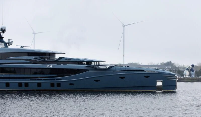 a large boat in the water aboard PHI Yacht for Sale