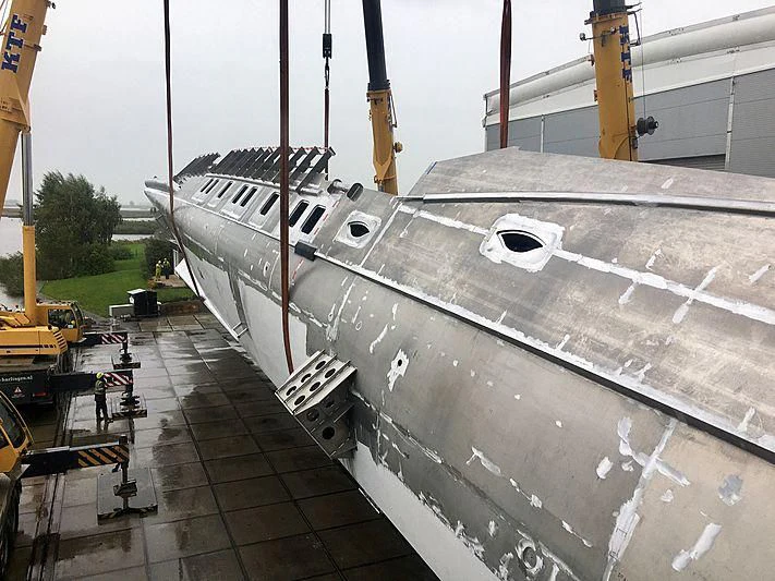 a large military plane aboard PHI Yacht for Sale