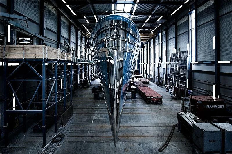 a large factory with blue pipes aboard PHI Yacht for Sale