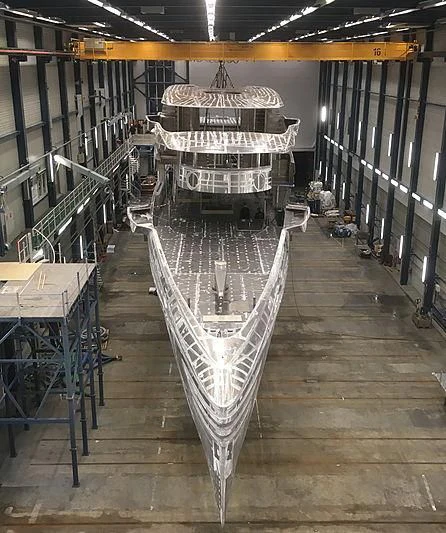 a large ship in a warehouse aboard PHI Yacht for Sale