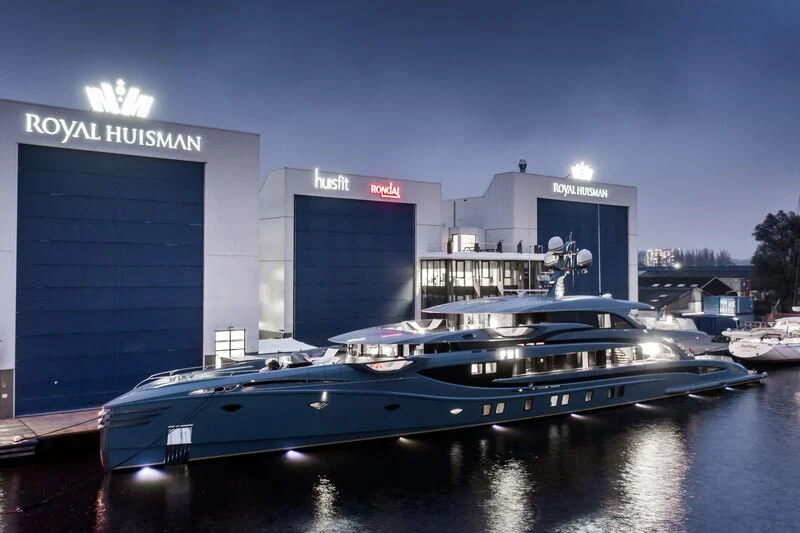 a large boat in a harbor aboard PHI Yacht for Sale