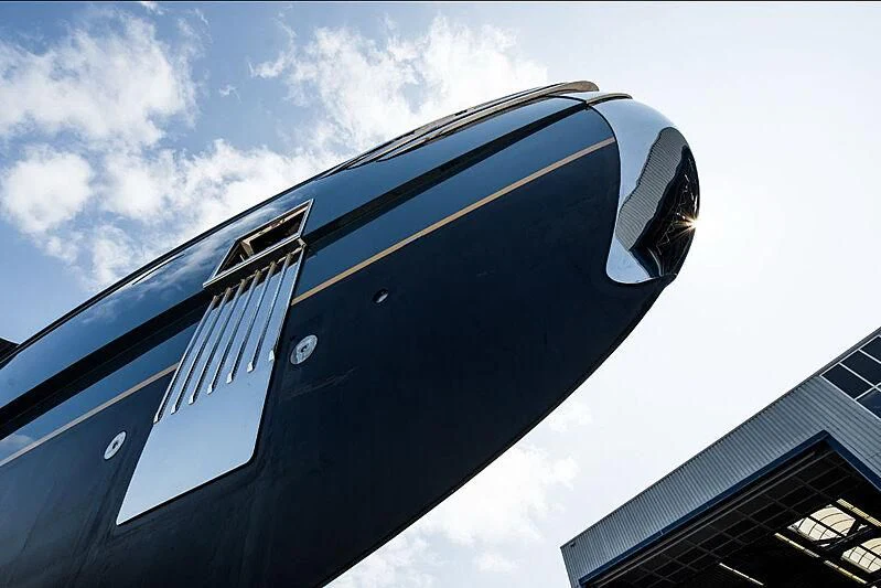 a black and gold car aboard PHI Yacht for Sale