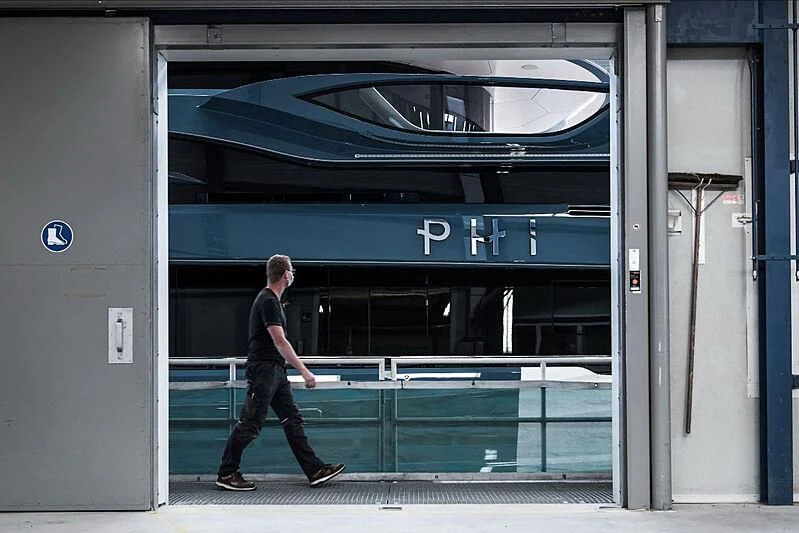 a person walking into a train aboard PHI Yacht for Sale