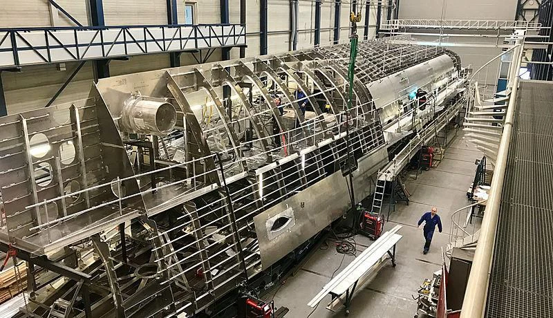 a person standing in a factory aboard PHI Yacht for Sale