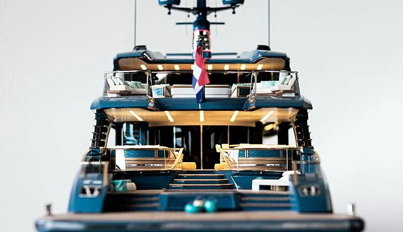 a boat with a flag on the front aboard PHI Yacht for Sale
