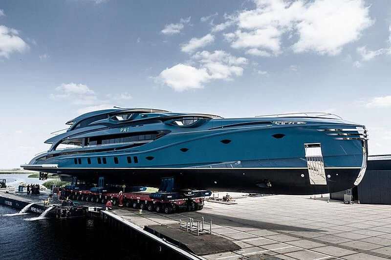 a large cruise ship docked aboard PHI Yacht for Sale