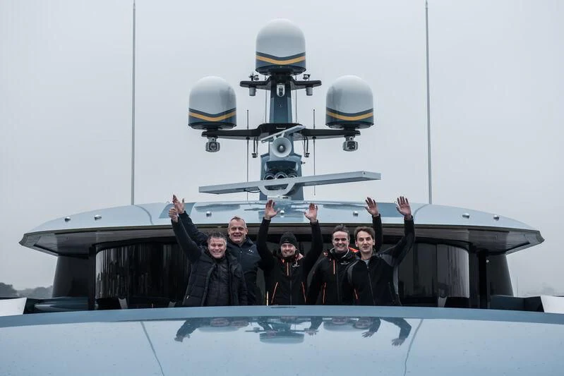 a group of people on a boat aboard PHI Yacht for Sale
