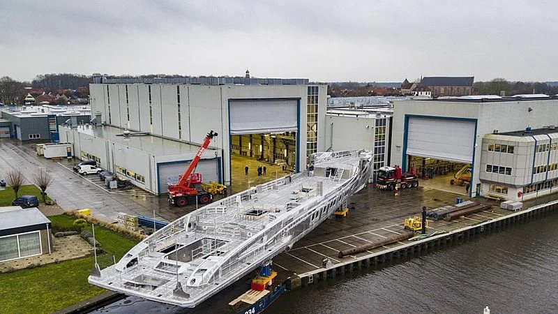 a building with a crane on the roof aboard PHI Yacht for Sale