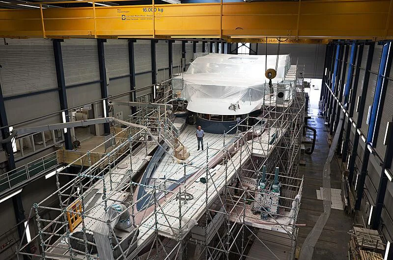 a large machine in a factory aboard PHI Yacht for Sale