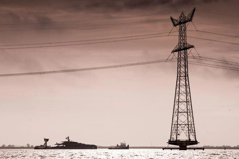 a large tower with a crane aboard PHI Yacht for Sale