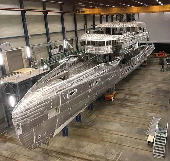 a large metal ship in a warehouse aboard PHI Yacht for Sale