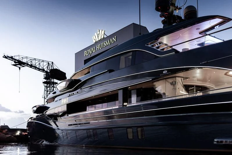 a large cruise ship docked aboard PHI Yacht for Sale