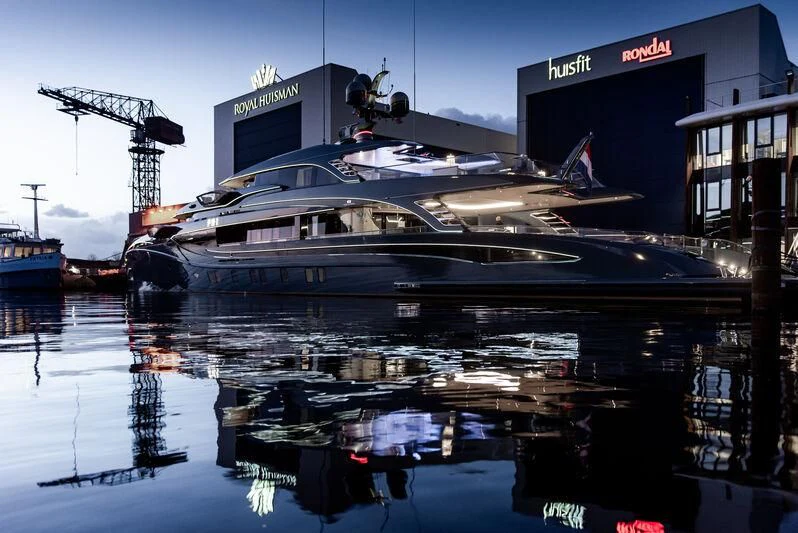 a boat docked at a pier aboard PHI Yacht for Sale