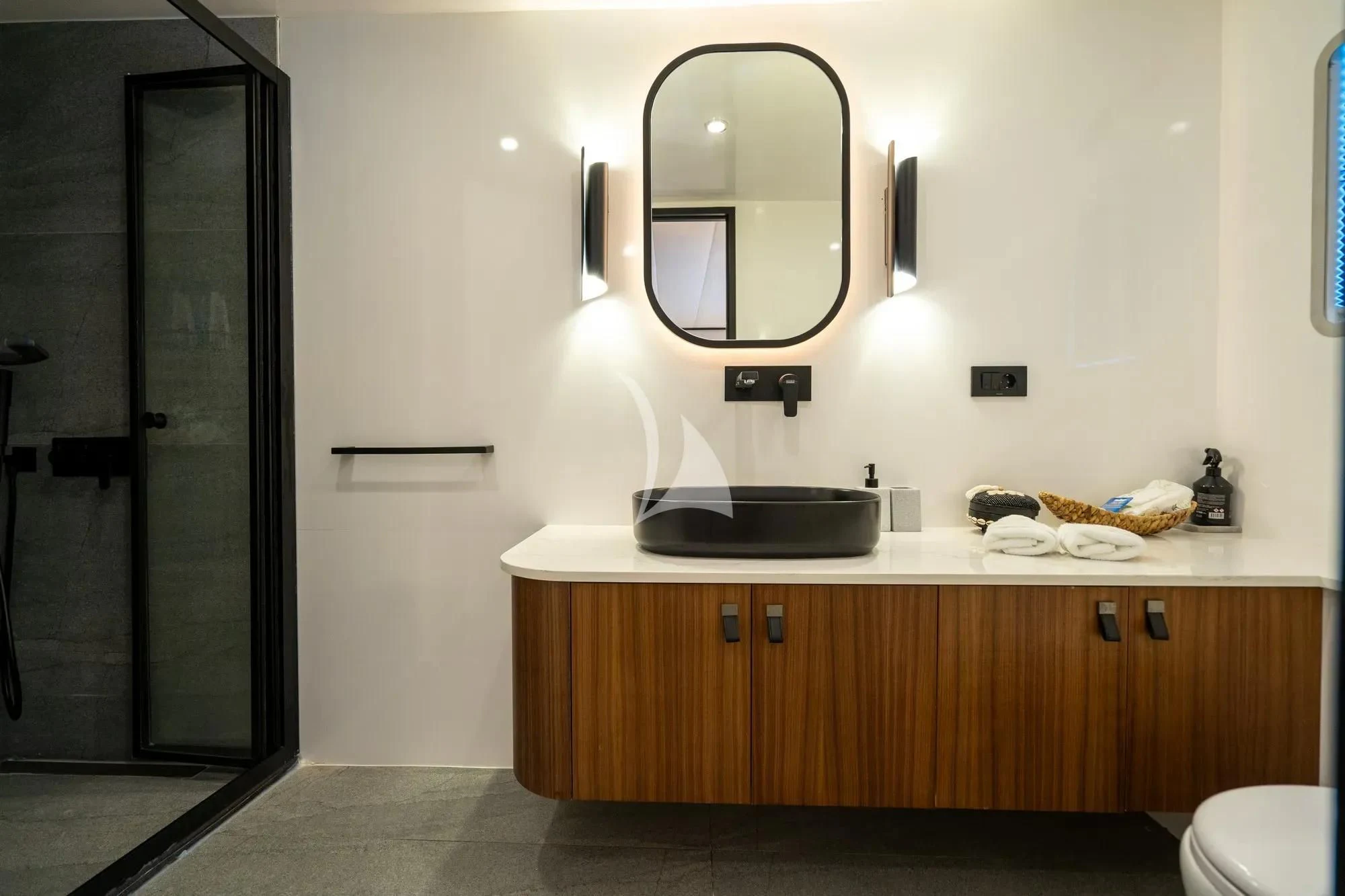 a bathroom with a sink and mirror aboard DE LOVE Yacht for Charter
