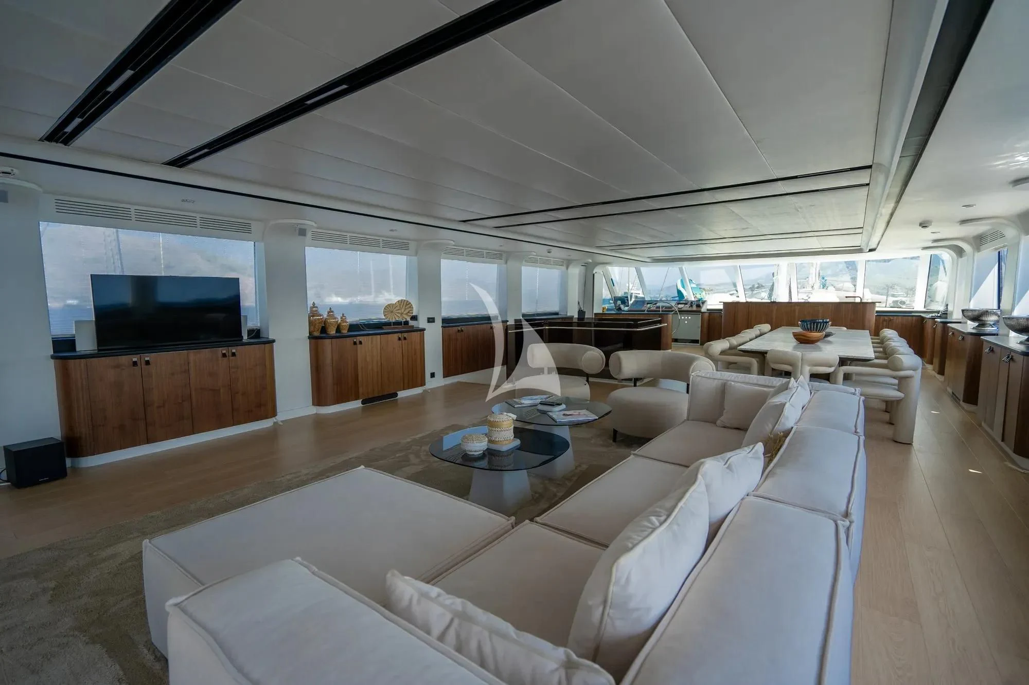a living room with a large window aboard DE LOVE Yacht for Charter