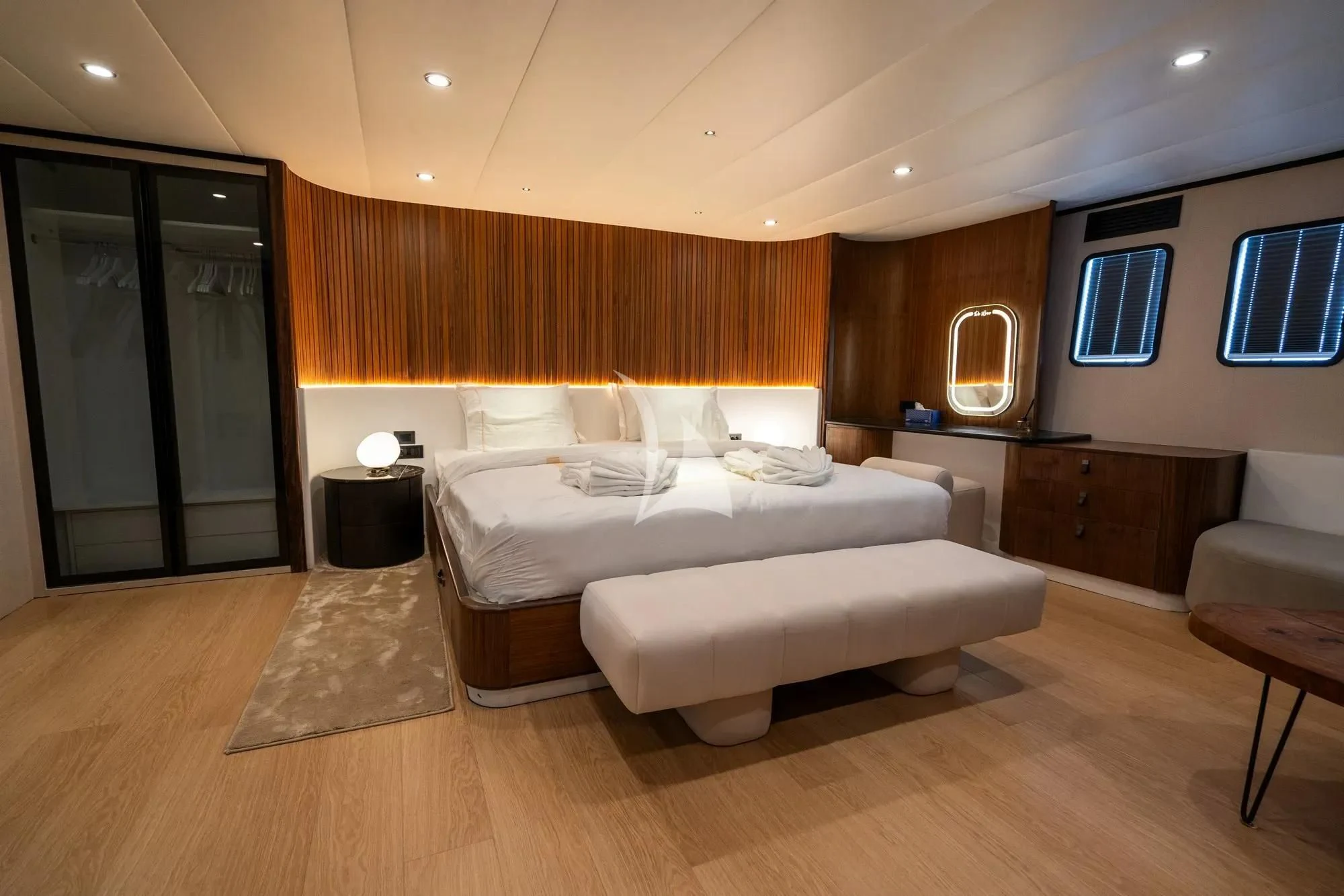 a room with a bed and a mirror aboard DE LOVE Yacht for Charter