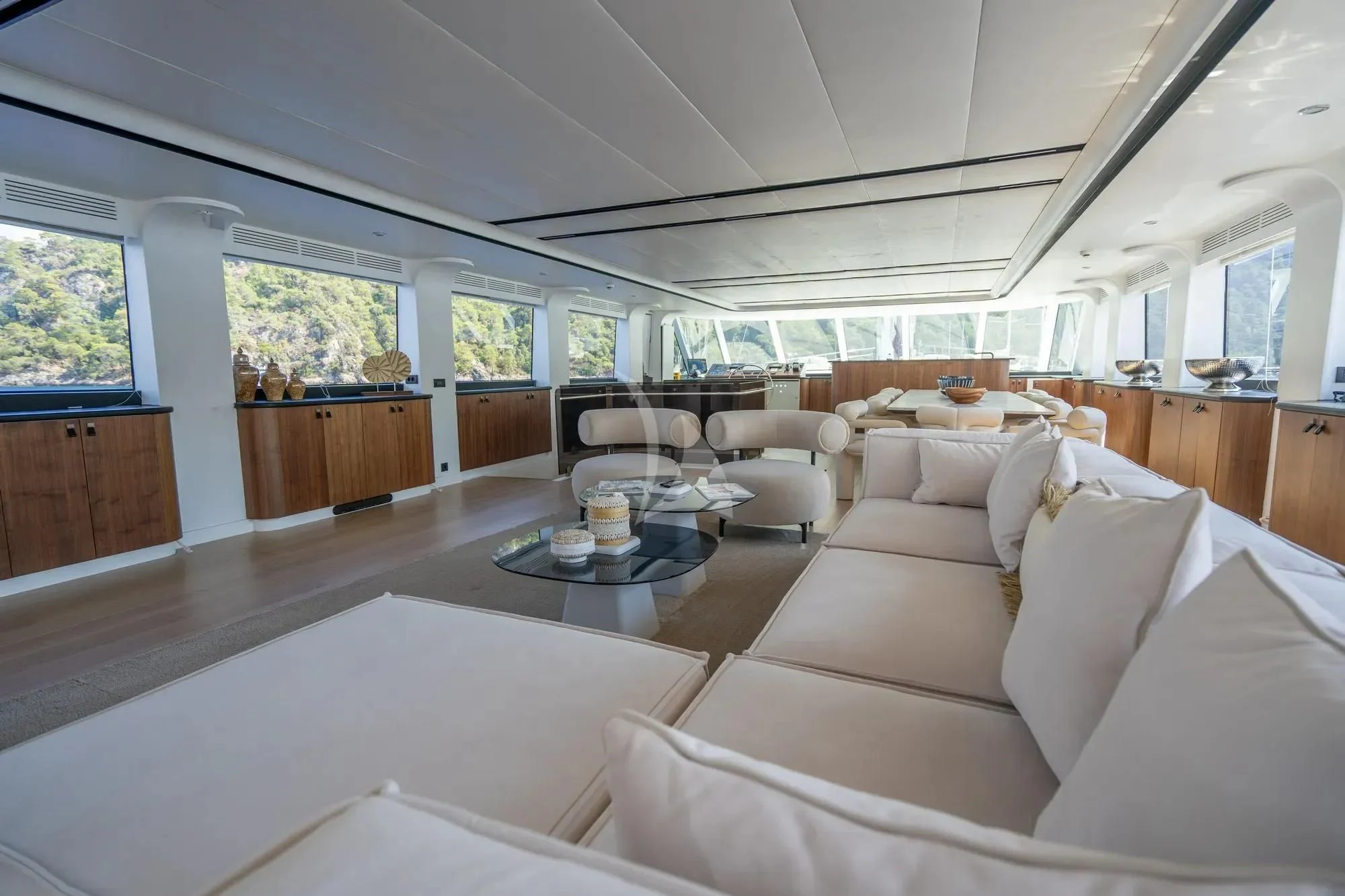 a living room with a large window aboard DE LOVE Yacht for Charter