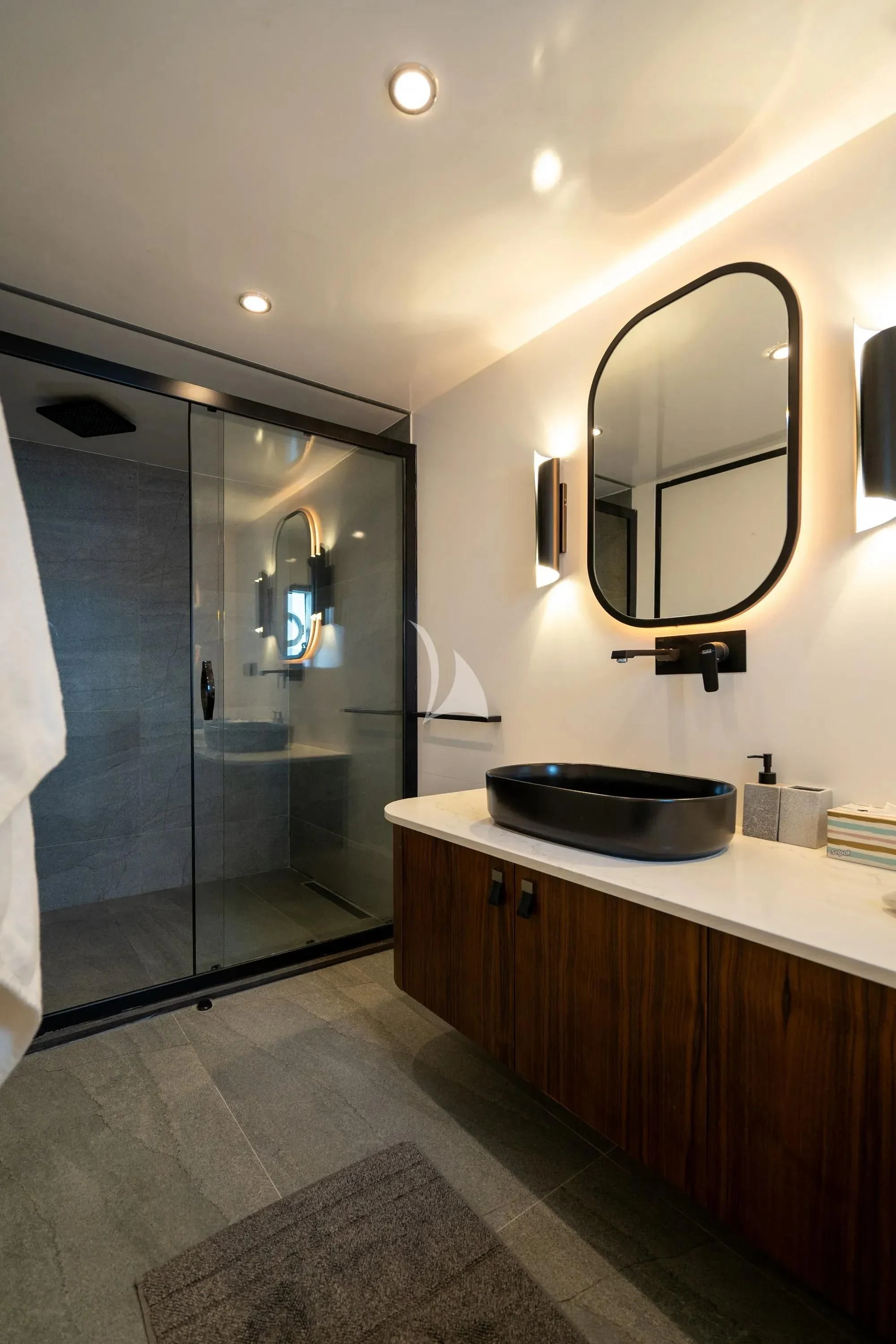 a bathroom with a large mirror aboard DE LOVE Yacht for Charter
