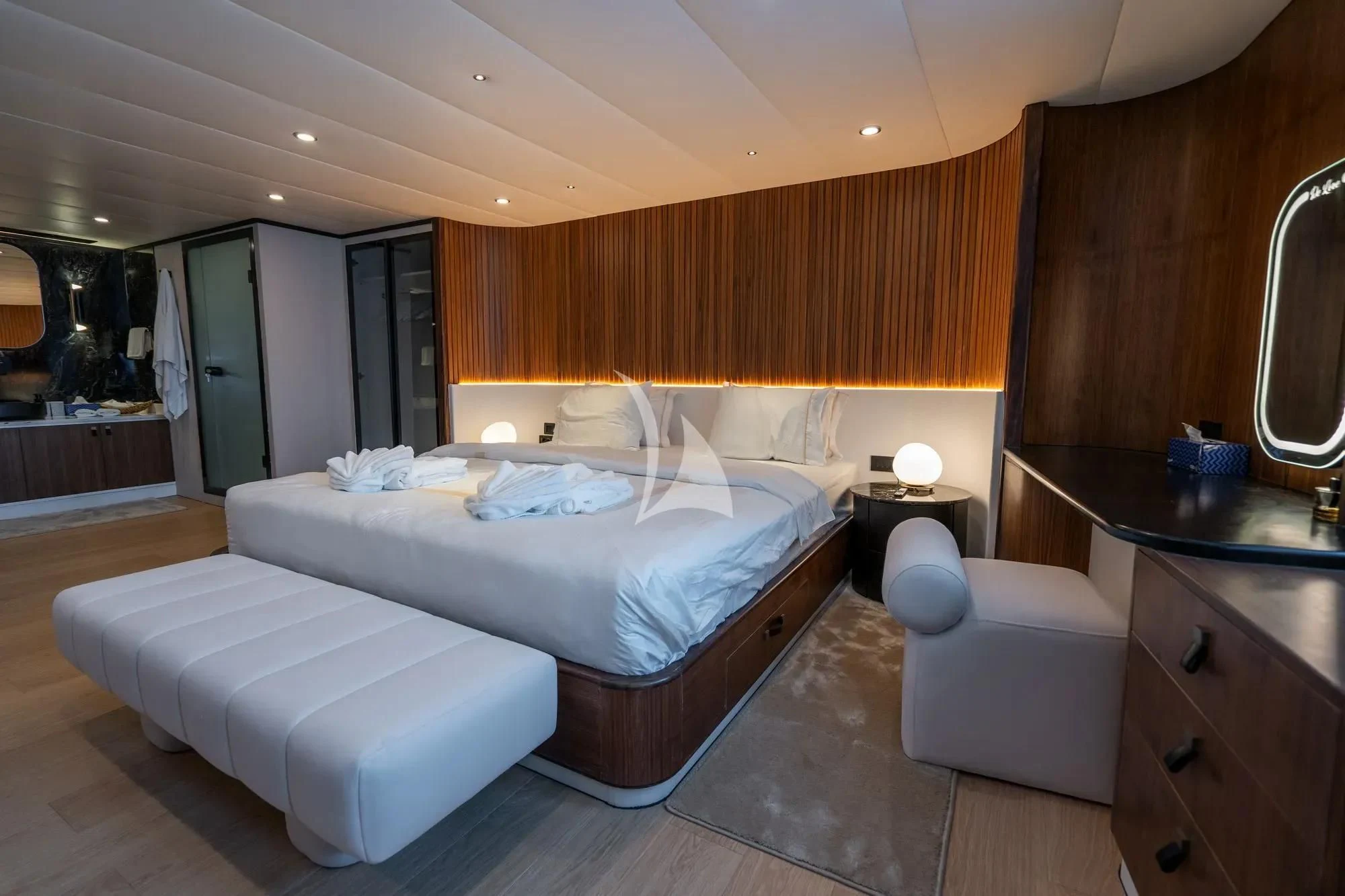 a room with a bed and a mirror aboard DE LOVE Yacht for Charter
