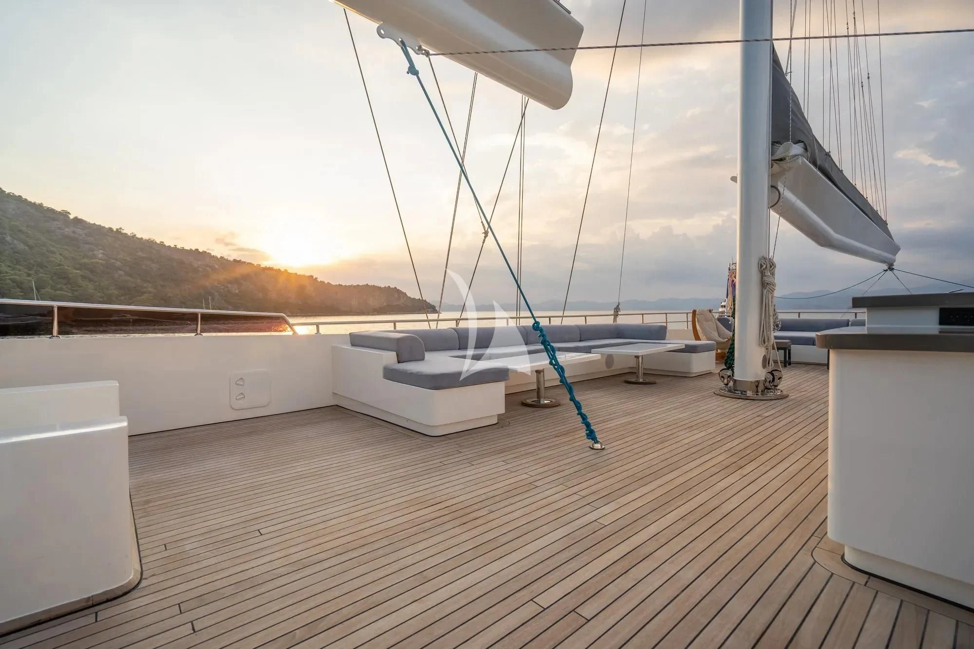 a deck with a large sailboat aboard DE LOVE Yacht for Charter
