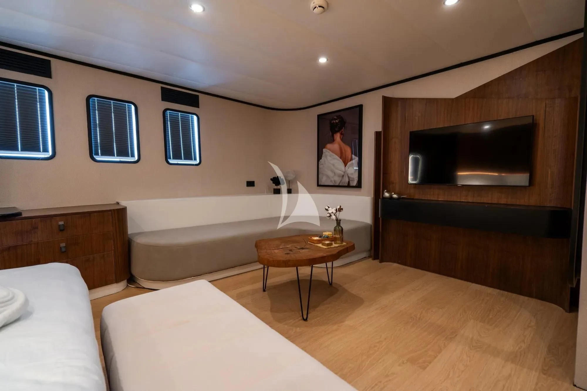 a living room with a tv and couches aboard DE LOVE Yacht for Charter