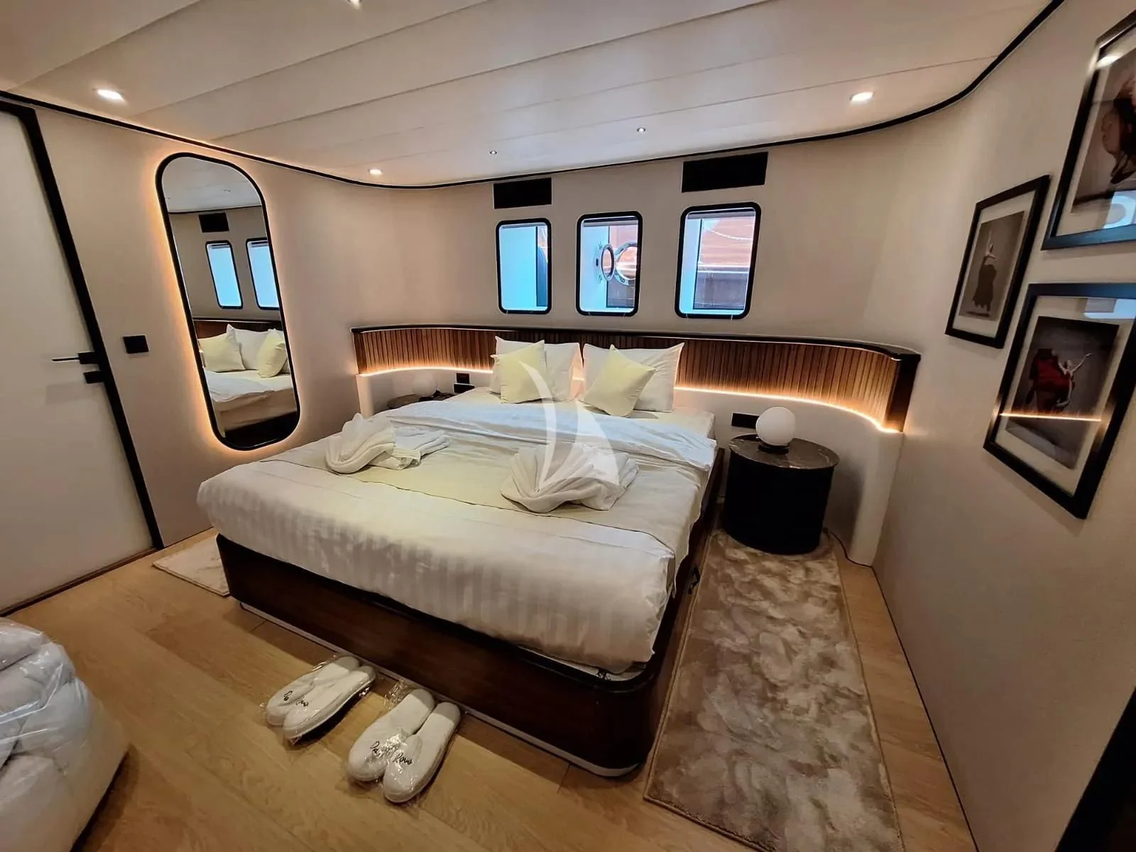 a bedroom with a bed and a television aboard DE LOVE Yacht for Charter