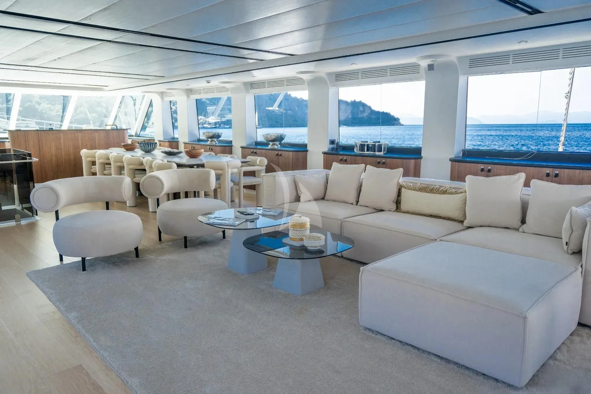 a living room with a large window aboard DE LOVE Yacht for Charter