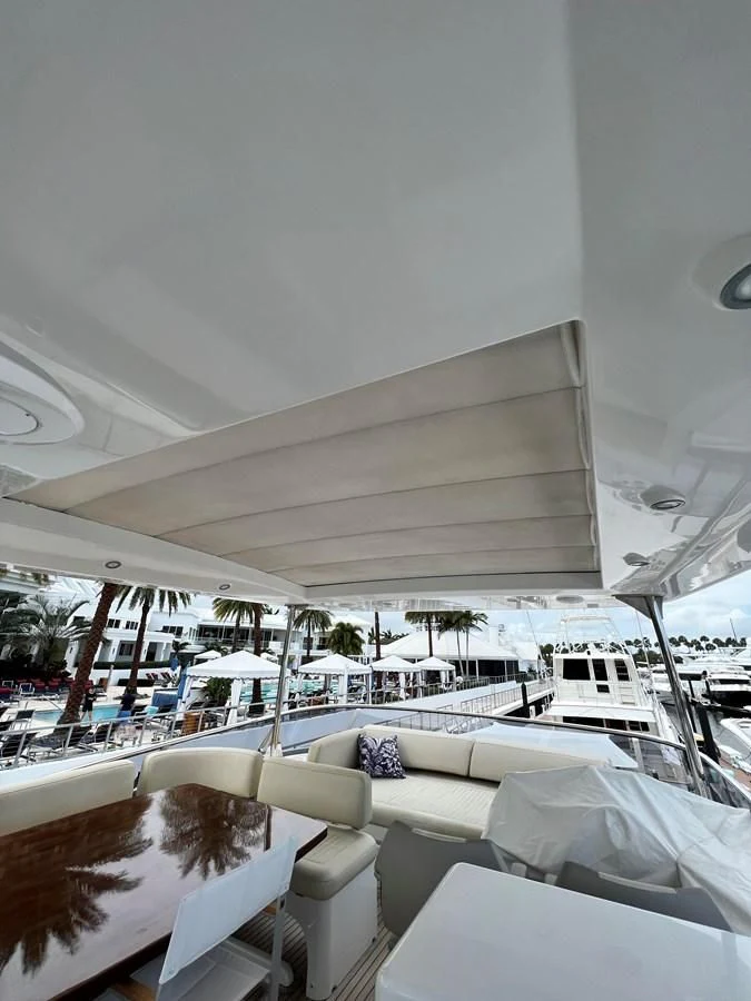 a boat with white chairs aboard PURA VIDA Yacht for Sale