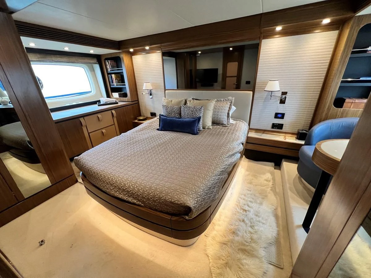 a large bedroom with a large bed aboard PURA VIDA Yacht for Sale