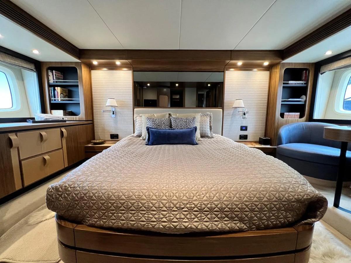 a large bed in a room aboard PURA VIDA Yacht for Sale