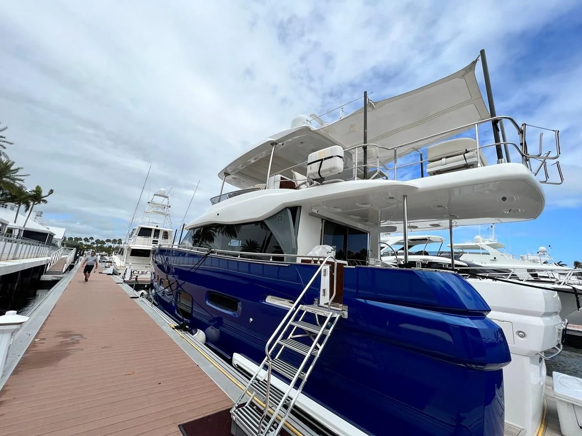 a boat docked at a pier aboard PURA VIDA Yacht for Sale