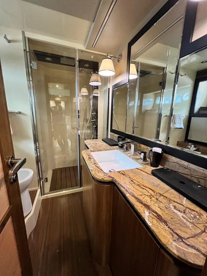 a bathroom with a large mirror aboard PURA VIDA Yacht for Sale